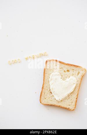 sandwich for breakfast in the form of heart with cheese - good morning inscription Stock Photo