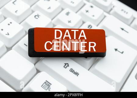 Hand writing sign Data Center, Word Written on a repository that houses computing facilities like servers Stock Photo