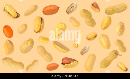Creative levitation peanut pattern on a light pastel beige background with peeled and unpeeled beans. Flat lay creative arrangement. Selective focus Stock Photo
