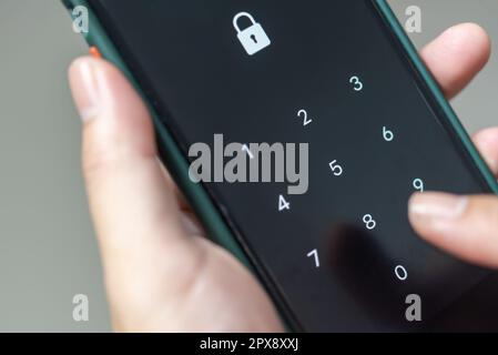 Hacking mobile phone with a password to access a smartphone, security threats online Phone lock code. Smartphone protection with 2fa Smartphone protec Stock Photo