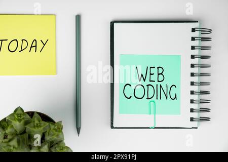 Sign displaying Web Coding, Internet Concept work involved in developing a web site for the Internet Stock Photo