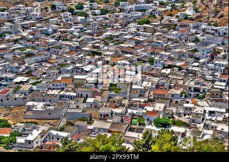 Bird's eye view of whitewashed bungalows on Greek island Rhodes in tourist resort Lindos Stock Photo