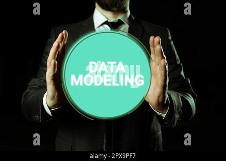 Hand writing sign Data Modeling, Business concept process of transferring data between data storage systems Stock Photo