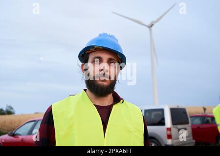 Male technician poses for photo looking at camera serious and confident gesture. Stock Photo