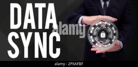 Conceptual display Data Sync, Word Written on data that is continuously generated by different sources Stock Photo