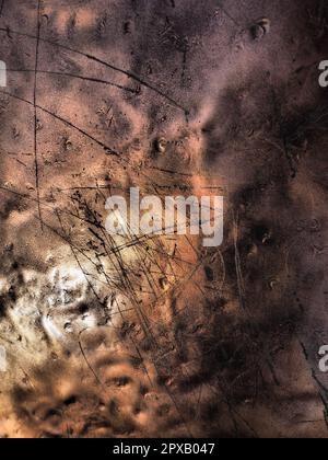 Metal bronze textured plate. Bronze or copper polished surface with dents, scratches and indentations. Metal texture. Stock Photo