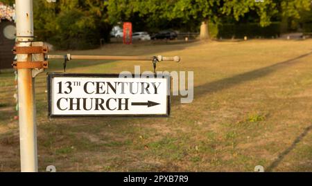 13th century church sign afternoon light Stock Photo