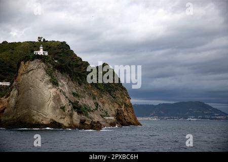 Capo Miseno and its lighthouse that marks the northwestern limit of the Gulf of Naples, Italy Stock Photo