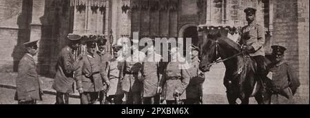 World War I. War and culture. German officers with satisfied faces pose on the ruins of Louvain Stock Photo