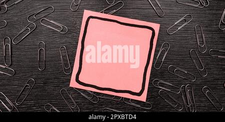 Paperclips Around Important Informations On Desk. Presented Recent Updates. Stock Photo