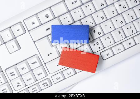 Colored cube with important message lying on keyboard. Main information. Stock Photo