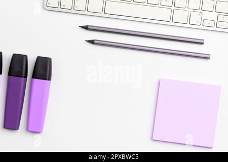 Paper with important text near keyboard. Information written on notebook. Stock Photo