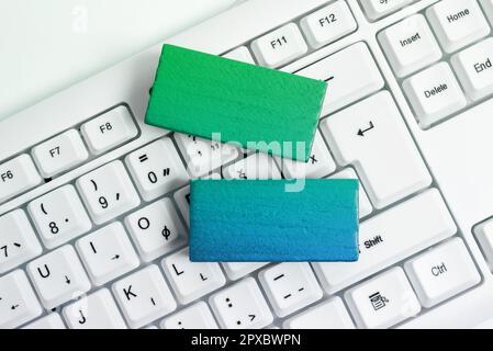 Colored cube with important message lying on keyboard. Main information. Stock Photo