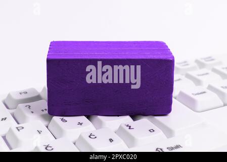 Colored cube with important message lying on keyboard. Main information. Stock Photo