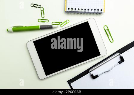 Phone With Important Message On Desk With pens, Calculator And Notebook. Stock Photo
