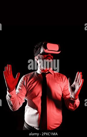 Man Wearing Vr Glasses And Presenting Important Messages Between Hands. Stock Photo