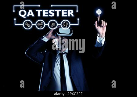 Writing displaying text Qa Tester, Word for Quality assurance of an on going project before implementation Stock Photo