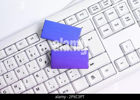 Colored cube with important message lying on keyboard. Main information. Stock Photo