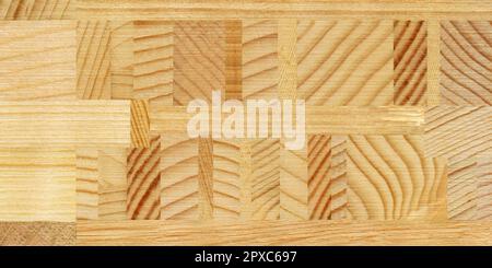 Wooden marquetry, patterns created from the combination of different woods, wooden floor, parquet, cutting board Stock Photo