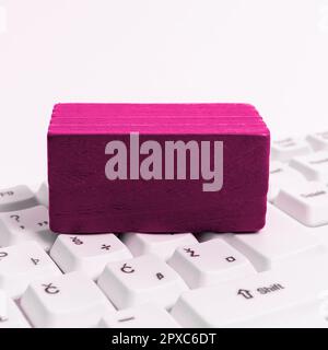 Colored cube with important message lying on keyboard. Main information. Stock Photo