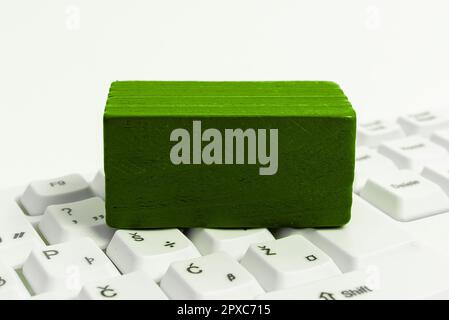 Colored cube with important message lying on keyboard. Main information. Stock Photo