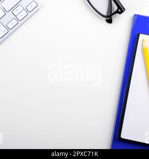Paper with important text near keyboard. Information written on notebook. Stock Photo