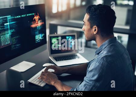 Gotta listen to your head when you get them thoughts. a man using a computer in a modern office. Stock Photo