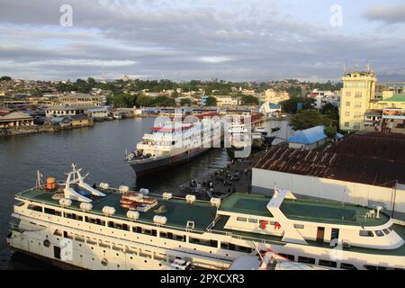 Ships are leaning on the harbor pier, side by side with each other Stock Photo