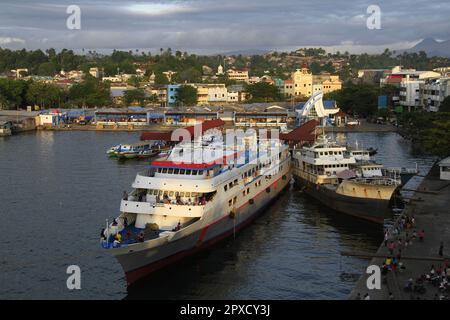 Ships are leaning on the harbor pier, side by side with each other Stock Photo