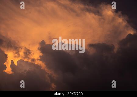 Colorful dramatic sky with cloud at sunset.Sky with clouds at sunset. Stock Photo