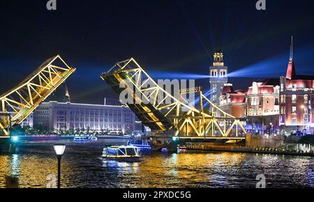 Tianjin, China. 1st May, 2023. A boat sails past the opened Jiefang Bridge in Tianjin, north China, May 1, 2023. The landmark bridge opened on Monday at a maximum angle of 60 degrees. Credit: Sun Fanyue/Xinhua/Alamy Live News Stock Photo