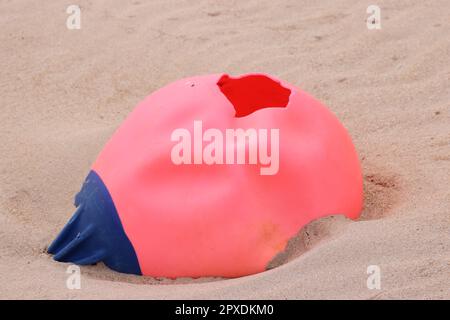 Plastic buoy washed up on beach Stock Photo