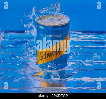 Can of Schweppes Lemonade submerged in water with water splashing over top of the can, Studio product image,Mansfield,Nottingham,United Kingdom. Stock Photo