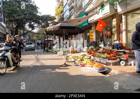 Hanoi, Vietnam, January 2023.  panoramic view of  the traditional food vendors on the  street in the city center. Stock Photo