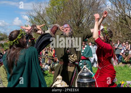 Glastonbury, Somerset, UK. 1st May, 2023. Thousands of people celbrated the pagan tradition of Beltane in the center of Glastonbury. A giant maypole was carriied through through the town to the bootom of Glastonbury Tor before being carried to Bushy Combe. A handfasting ceremony took place to marry the May King and Queen. Credit: Natasha Quarmby/Alamy Live News Stock Photo