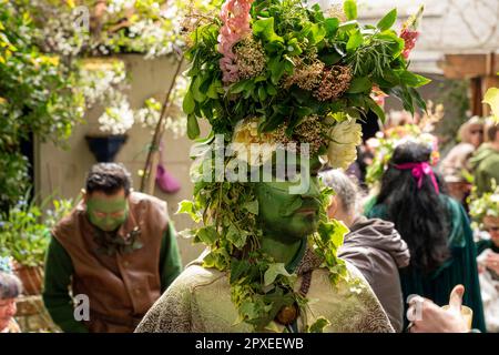 Glastonbury, Somerset, UK. 1st May, 2023. Thousands of people celbrated the pagan tradition of Beltane in the center of Glastonbury. A giant maypole was carriied through through the town to the bootom of Glastonbury Tor before being carried to Bushy Combe. A handfasting ceremony took place to marry the May King and Queen. Credit: Natasha Quarmby/Alamy Live News Stock Photo