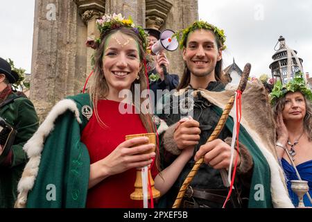 Glastonbury, Somerset, UK. 1st May, 2023. Thousands of people celbrated the pagan tradition of Beltane in the center of Glastonbury. A giant maypole was carriied through through the town to the bootom of Glastonbury Tor before being carried to Bushy Combe. A handfasting ceremony took place to marry the May King and Queen. Credit: Natasha Quarmby/Alamy Live News Stock Photo