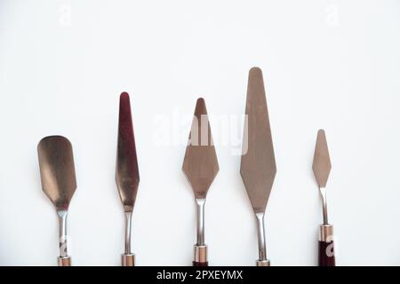 Five Art Palette Knives on a White background Stock Photo