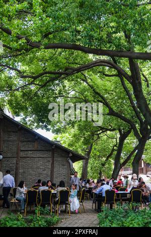 Tongxiang, China's Zhejiang Province. 2nd May, 2023. Tourists take a rest at Puyuan Fashion Resort in Puyuan Town of Tongxiang City, east China's Zhejiang Province, May 2, 2023. Puyuan Fashion Resort receives nearly 20,000 tourists every day during this year's May Day holiday. The resort opened to the public on March 1. Credit: Xu Yu/Xinhua/Alamy Live News Stock Photo