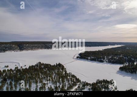 Aerial view of Lake Mary in Arizona, covered in a blanket of white snow after a winter storm Stock Photo