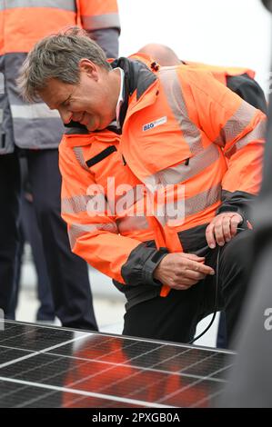 Bremen, Germany. 02nd May, 2023. Federal Minister of Economics Robert Habeck (Bündnis 90/Die Grünen) on the roof of the BLG Logistics Center C3. Thanks to a solar installation on almost the entire roof area, the logistics center is largely self-sufficient in electricity. Credit: Lars Klemmer/dpa/Alamy Live News Stock Photo