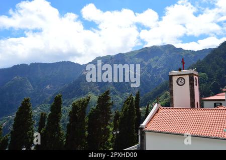 Photo view of church with red roof on a green tropical mountain Stock Photo