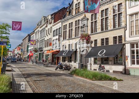 Shops, bars, cafes, offices in cobbled Korenmarkt, Mechelen, Belgium Stock Photo