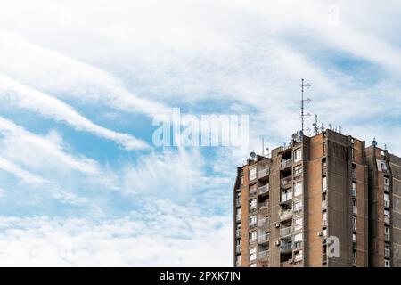 Brutalist architecture example, high apartment building skyscraper made of concrete with air conditioners on facade Stock Photo