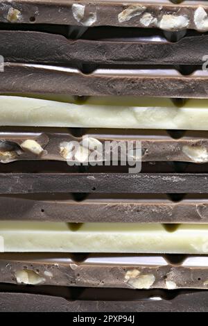 Dark, milk, hazelnut and white chocolate in a stack Stock Photo