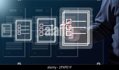 A man with a marker is checking and analyzing virtual documents. Paperless circulation of documents, remote control Stock Photo