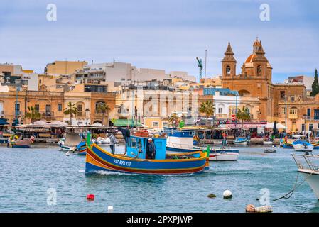 Traditional fishing boats in the Mediterranean Village of Marsaxlokk, Malta Stock Photo