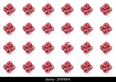 Seamless pattern of frozen berries on white background. Frozen organic raspberry in white bowls on white. Frozen berries retain all vitamins. Sustaina Stock Photo