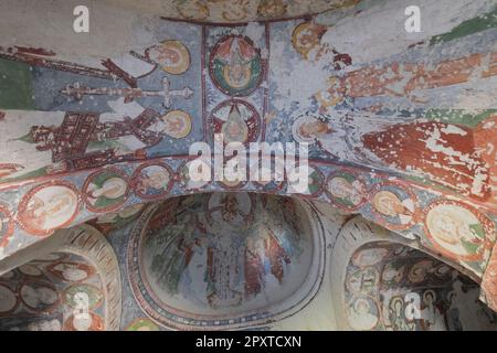 Fresco Christian Decoration on Ceiling background in cave orthodox El Nazar Old Church at the Goreme open air museum, Cappadocia, Anatolia, Turkey Stock Photo