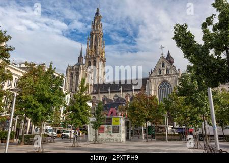 Historic gothic Cathedral of Our Lady, Onze lieve Vrouwe kathedraal seen from tree lined square - Groenplaats in Old Town, Antwerp. Stock Photo